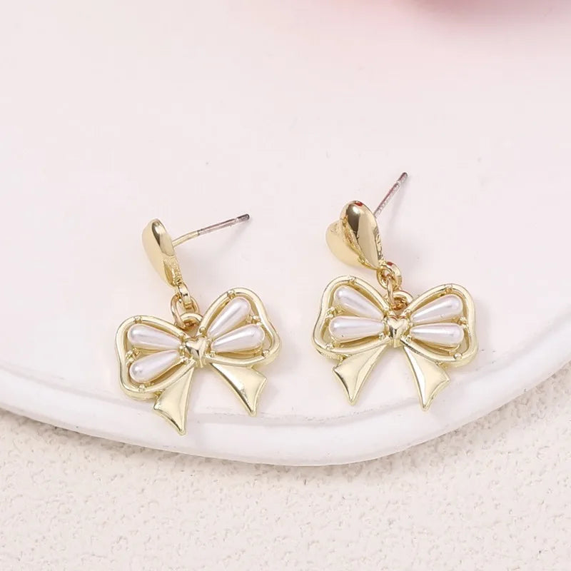 Korean Version of Sweet Internet Celebrity Mori Alloy Pearl Butterfly Niche Earrings, Fashionable Fairy Beauty Versatile Summer